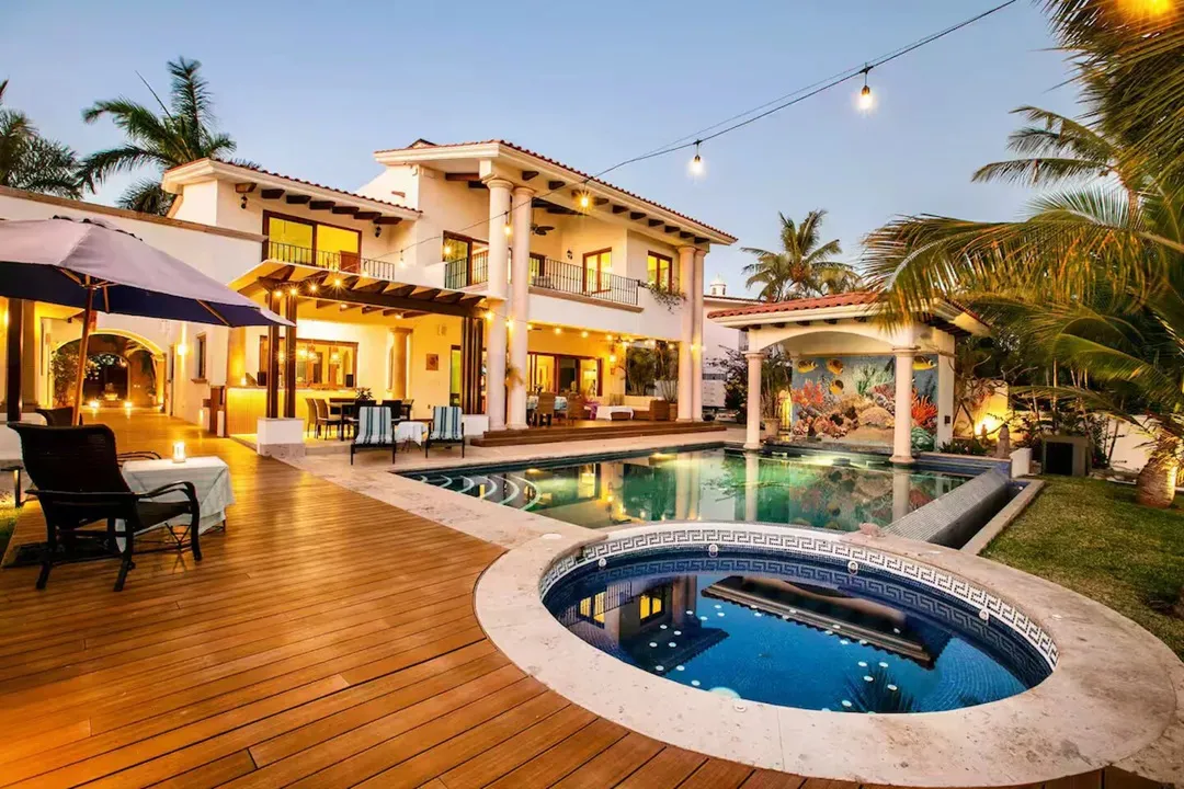 Villa courtyard, pool and hot tub at twilight