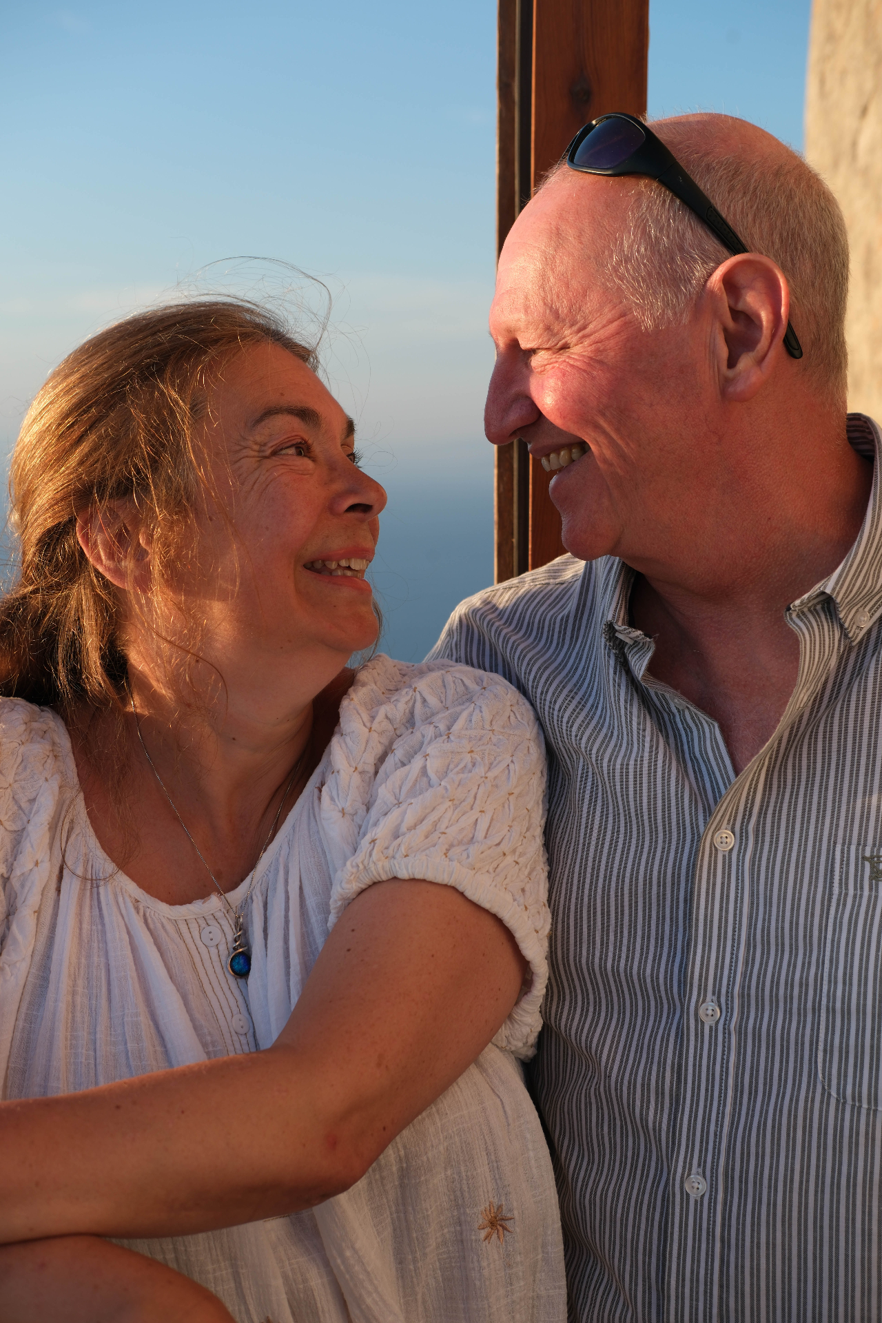 Guests at golden hour above the sea