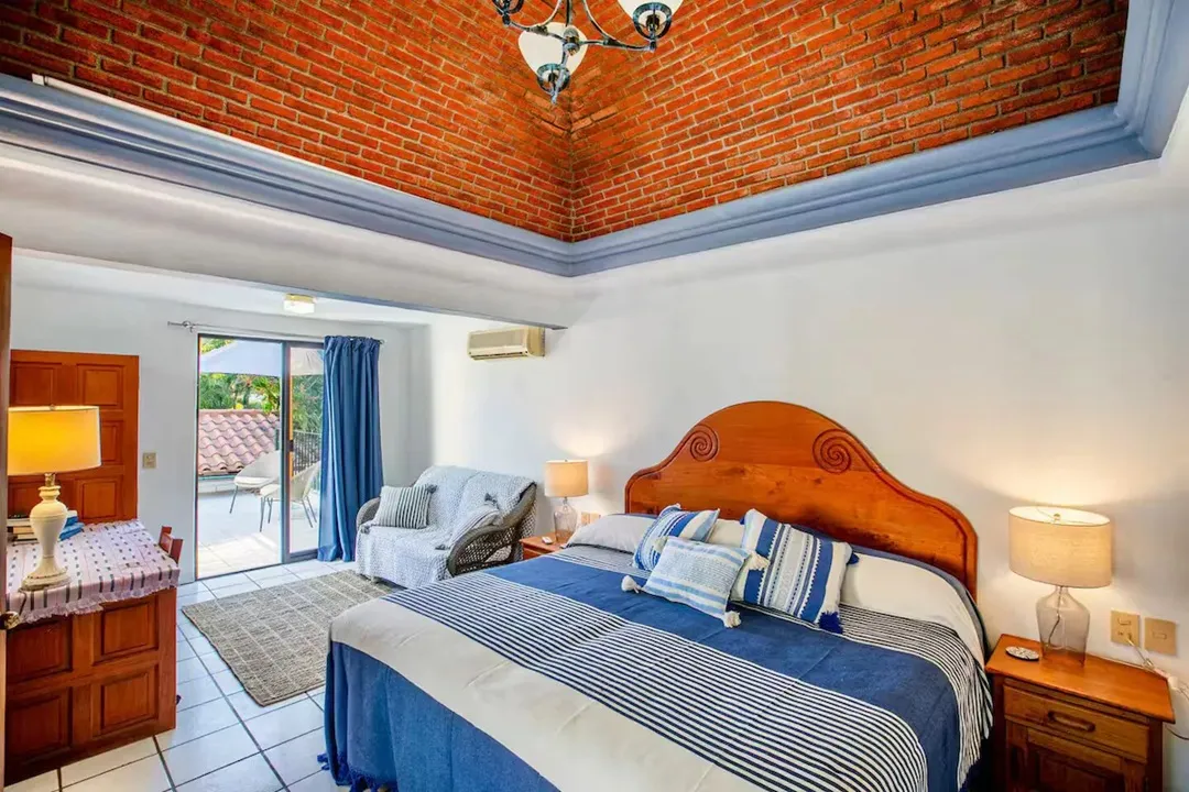 Ensuite bedroom with vaulted brick ceiling