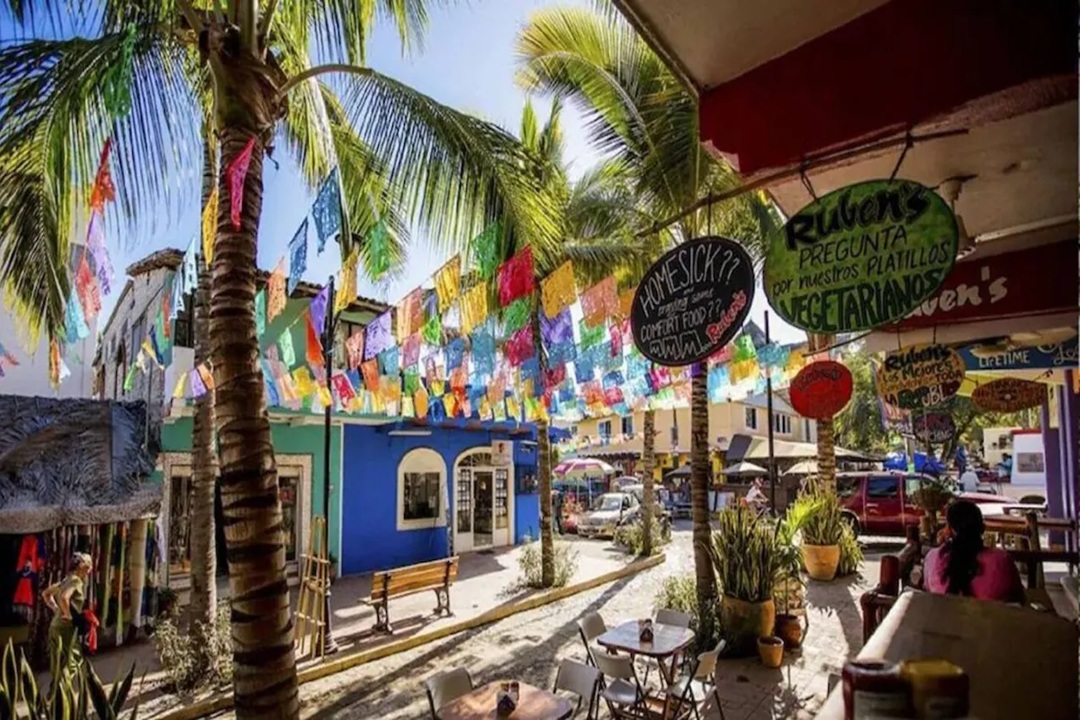 Papel picado bunting over a Sayulita street